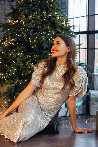 istock Woman sitting among Christmas atmosphere 1436493244