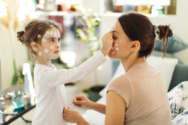 istock Girl with chickenpox at last stage sitting at home in quarantine 1436493317