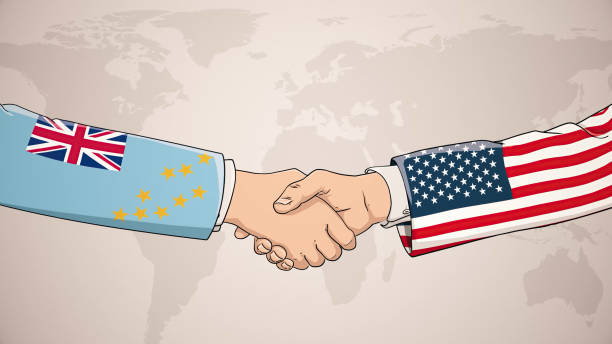 istock Cooperation between Tuvalu and USA in front of world map. The concept of America, handshake, business agreement, politics, meeting, country flags, celebrate, international friendship relations, diplomats shaking hands, peace trade policy 1436495988