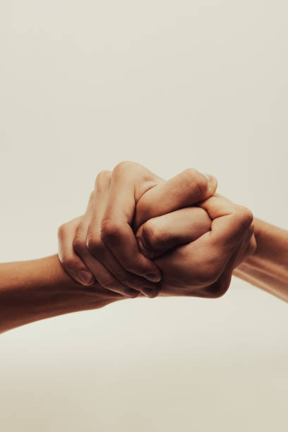istock strong male handshake with bare hands on a white background 1436496909