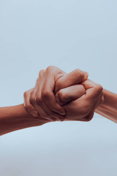 istock strong male handshake with bare hands on a white background 1436496923