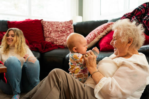 istock Great grandma holds baby 1436497283