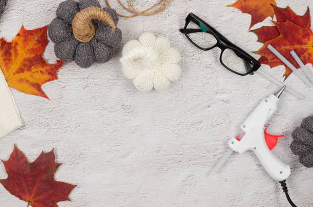istock DIY knitted pumpkin. Process of creating decorations for Halloween with your own hands. 1436498050