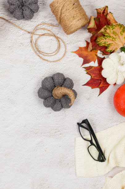istock DIY knitted pumpkin. Process of creating decorations for Halloween with your own hands. 1436498052