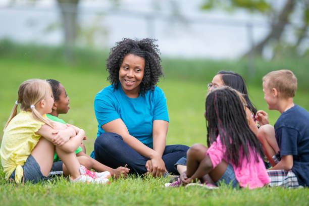 istock Camp Counselor with Children 1436498781