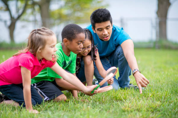 Day Camp Counselor Exploring with Children