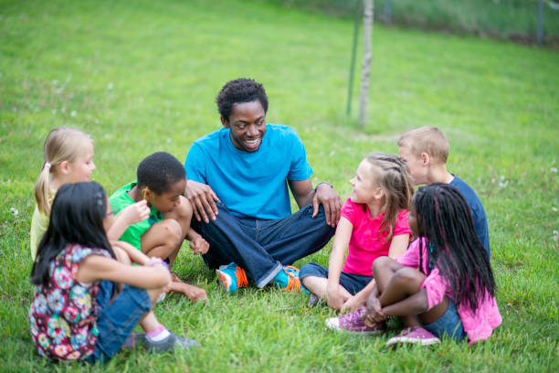 istock Camp Counselor with Children 1436498801