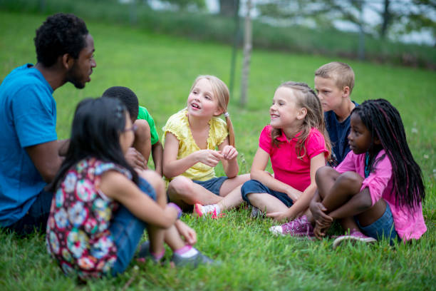 istock Camp Counselor with Children 1436498808