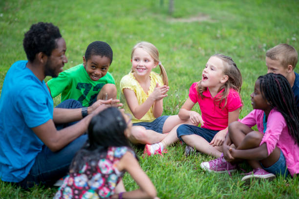Camp Counselor with Children stock photo