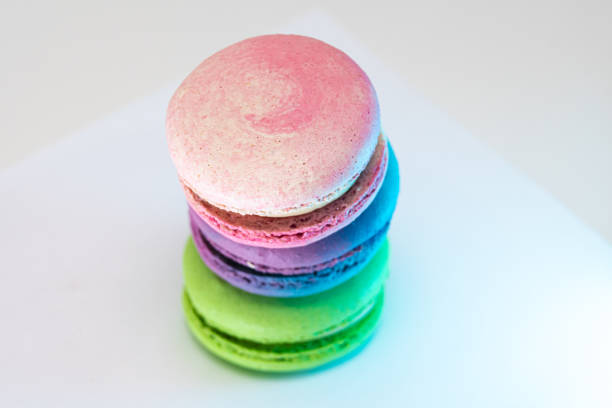 Delicious colorful french macarons on a white background, close up view. Desserts, food concepts, different colors, different flavors, isolated