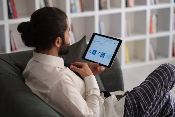 istock businessman working from home online sitting at home office with laptop during quarantine 1436502045