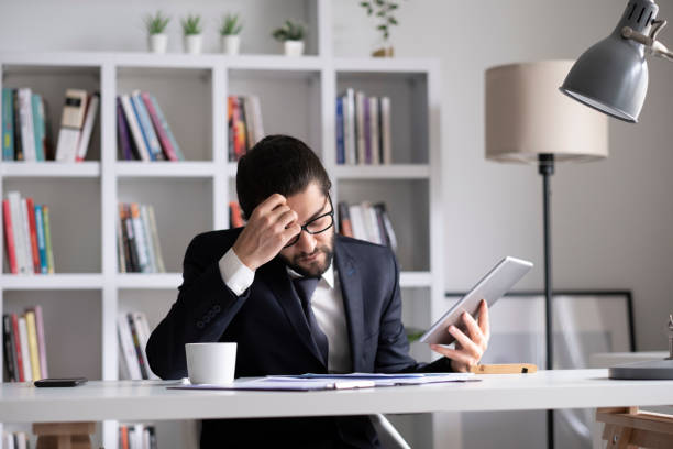 istock businessman working from home online sitting at home office with laptop during quarantine 1436502755