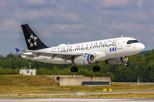 Oslo, Norway - August 15, 2022: SAS Scandinavian Airlines Airbus A319 airplane with Star Alliance special livery at Oslo airport (OSL) in Norway.