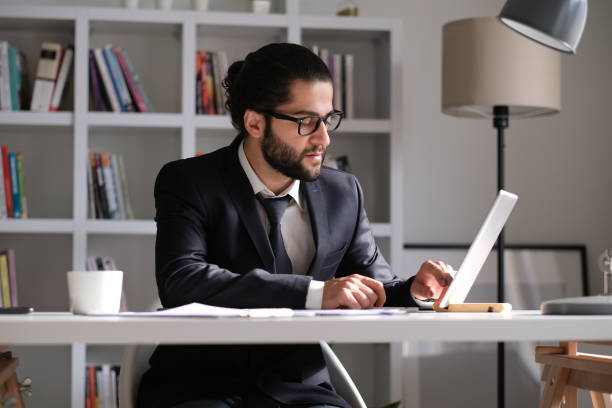 istock Businessman working at home with pajamas 1436505401