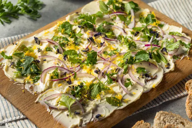 Homemade Trendy Butter Board with Herbs and Bread