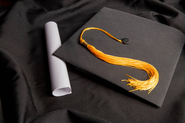 istock Black Graduation Cap Gown and Diploma 1436511986