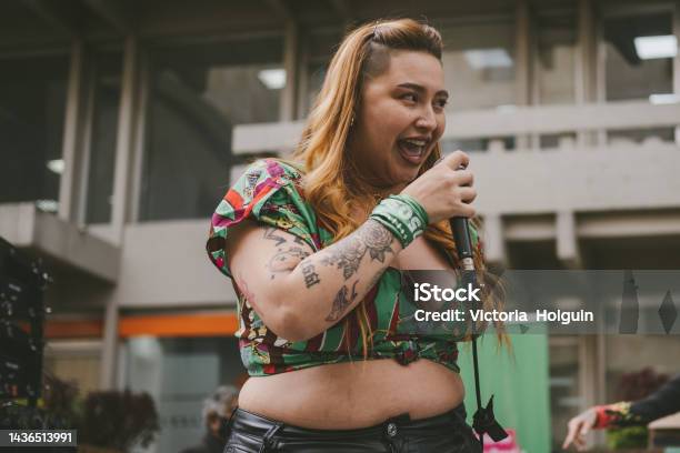 Woman Singing Stock Photo - Download Image Now - Rap, Rapping, Singer