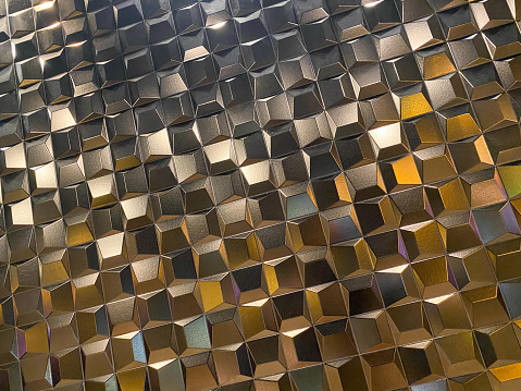 Beautiful golden carved convex shiny squares. Background, texture.