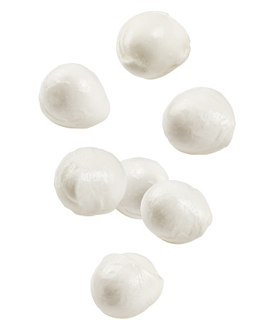 Falling Mozzarella cheese isolated on white background, clipping path, full depth of field