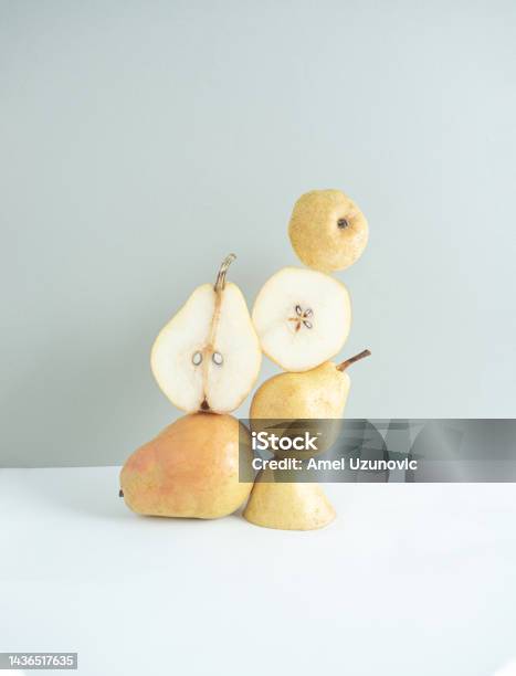 Autumn Fruit Creative Still Life Composition Pear And Pear Slices On A White And Grey Background Stock Photo - Download Image Now