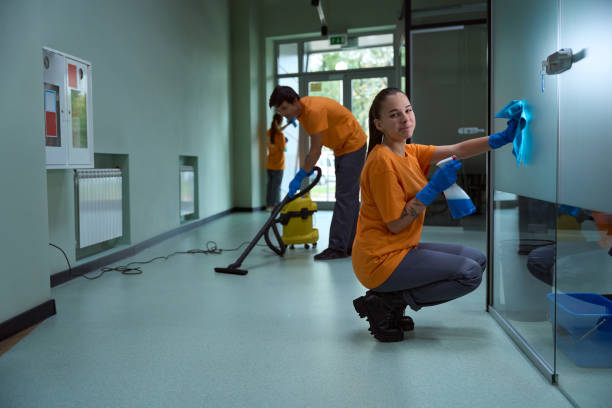 istock Cleaning company workers looking busy while scrubbing the room 1436521799