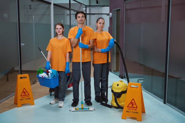 istock Young workers of cleaning company standing together with tools 1436521851