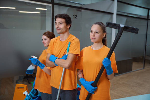 istock Cleaning service workers posing with their professional equipment 1436521873