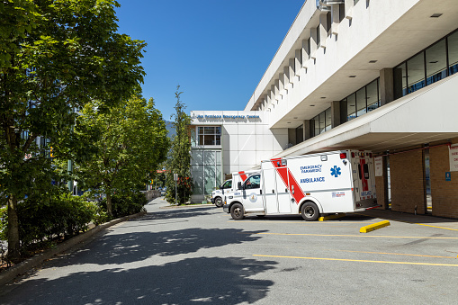 North Vancouver, Canada - July 12,2022: An ambulance in front of Lions Gate Hospital Emergency Department
