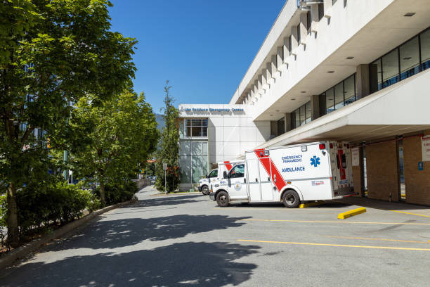 An ambulance in front of Lions Gate Hospital Emergency Department stock photo