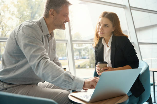 istock Office workers are viewing working material in a laptop 1436525324