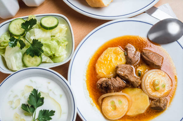 Potato dish with boiled meat, accompanied by a bowl of tzatziki. It is one of the traditional dishes that Turks love.