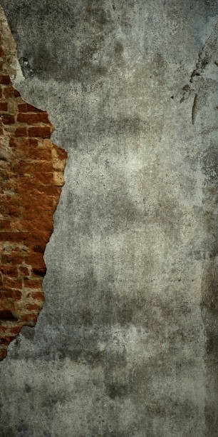 istock creative brick wall background with partially collapsed gray cement plaster. brutal backdrop for artistic decoration or vintage design 1436531261