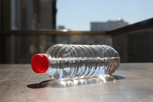 Plastic water bottle on table