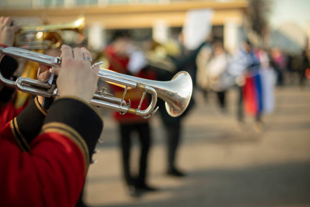 istock Orchestra with wind instruments. Trumpeters in ceremonial uniforms. 1436537205