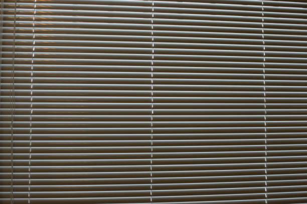 istock Texture of blinds. Horizontal stripes. Light through blinds. 1436537309