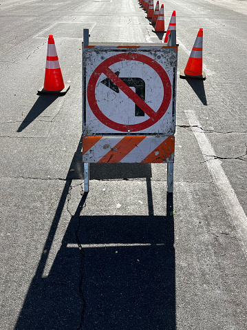 NO LEFT TURN road sign at a construction site