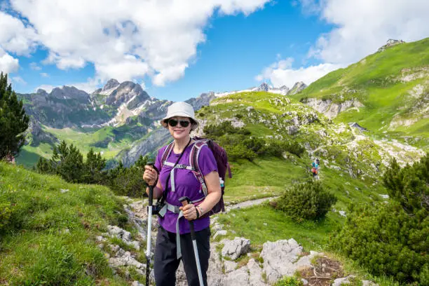 Portrait of a Senior Asian woman hiking the Ebenalp area of the Swiss Alps.
