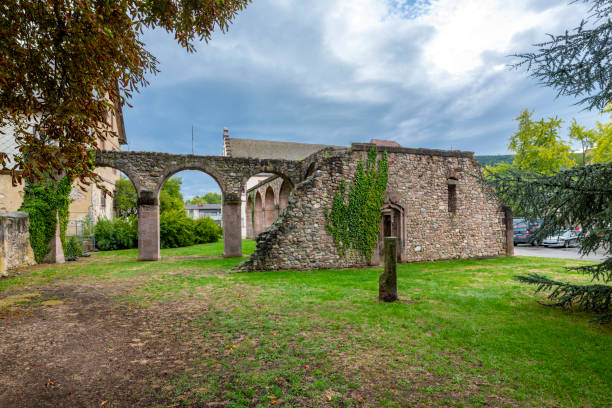 the ruins of the 17th century abbey of saint gregory in the village of munster, france, in the alsace region. - haut rhin imagens e fotografias de stock