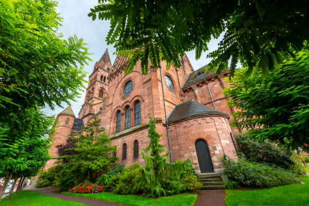 the imposing 19th century protestant church in the commune of munster, france, in the haut-rhin department in grand est in northeastern france. - haut rhin imagens e fotografias de stock