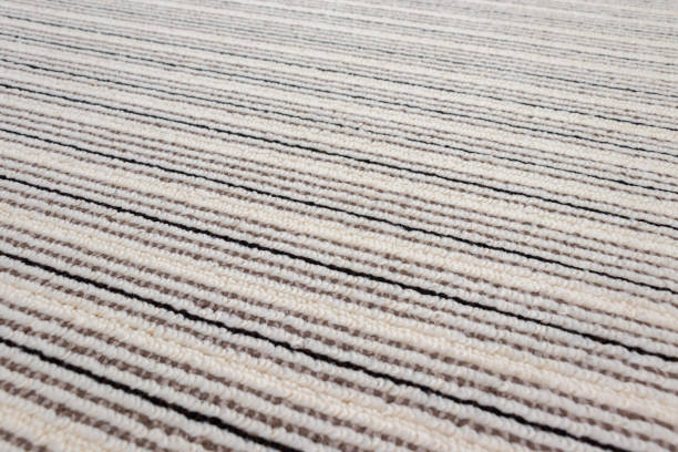 Surface of the carpet with diagonal stripes