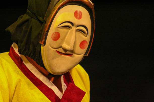 Man wearing a traditional Korean mask during a performance at the Andong International Mask Dance Festival in Andong South Korea.