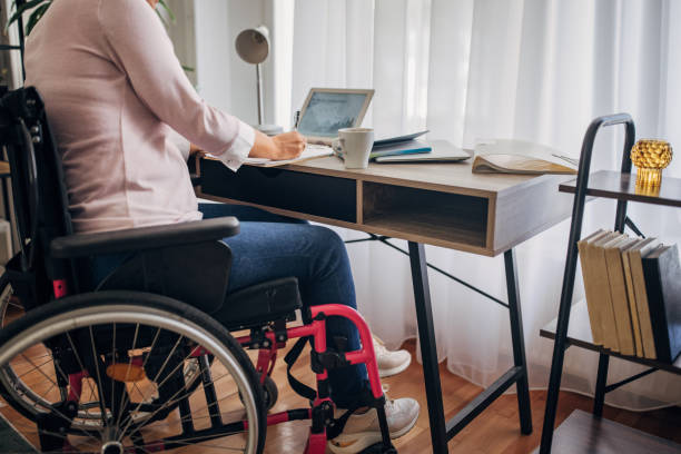 istock Disabled woman in home office 1436549088