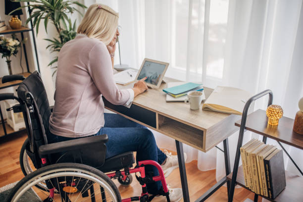 istock Disabled woman in home office 1436549721