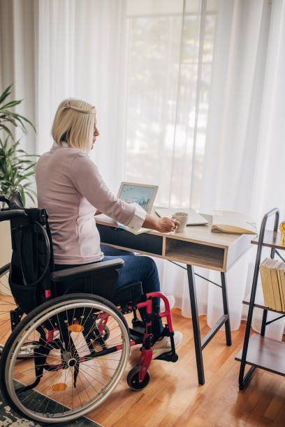 istock Disabled woman in home office 1436549940