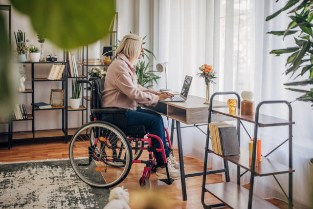 istock Disabled woman in home office 1436550199