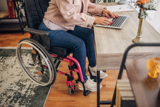 istock Disabled woman in home office 1436550206