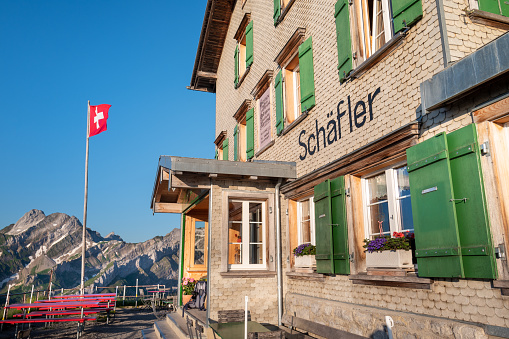 Appenzell, Switzerland - June 26, 2022: Shelter and meals for hikers at the Berggasthaus Schaefler mountain hut. The hut provides spectecular views of the Alpstein region mountain range.