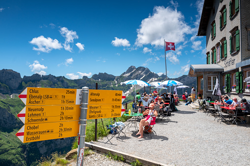 Trail signpost directing hikers in the appenzell innerrhoden area of the Swiss Alps near the Berggasthaus Schaefler