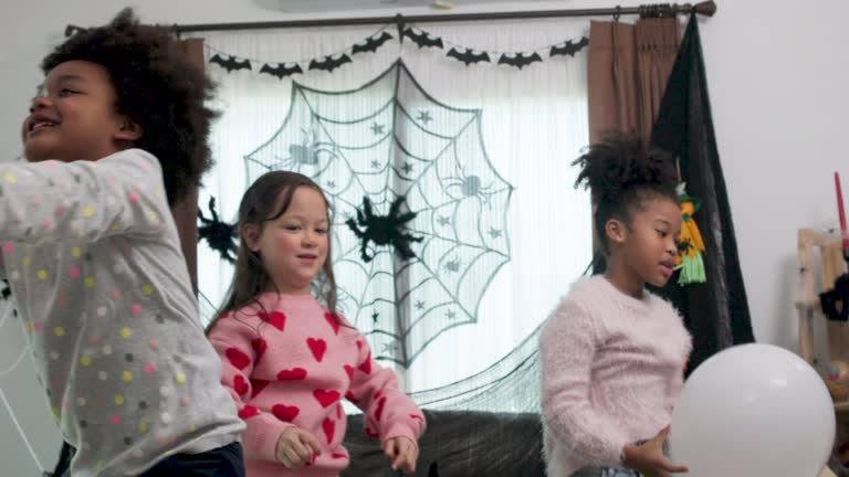 Slow-motion  Children having fun at a Halloween party , Halloween Dance