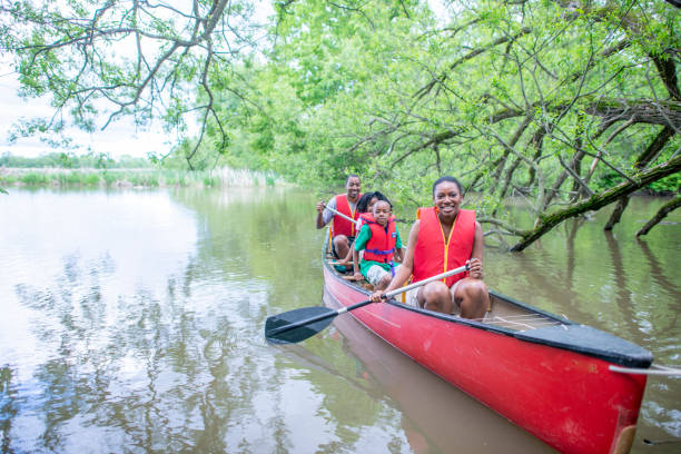 istock Family Paddling a Canoe 1436553461